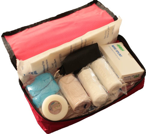 A photograph of a compact first aid kit containing essential medical supplies. The small kit includes bandages, adhesive strips, antiseptic wipes, and other basic first aid items. Its size suggests portability and convenience, making it suitable for on-the-go or personal use. This image represents a handy and compact solution for addressing minor injuries